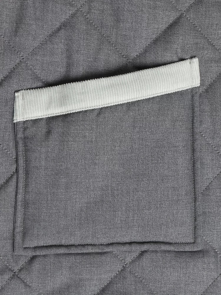 Women's coat by Thom Browne, outerwear detail view