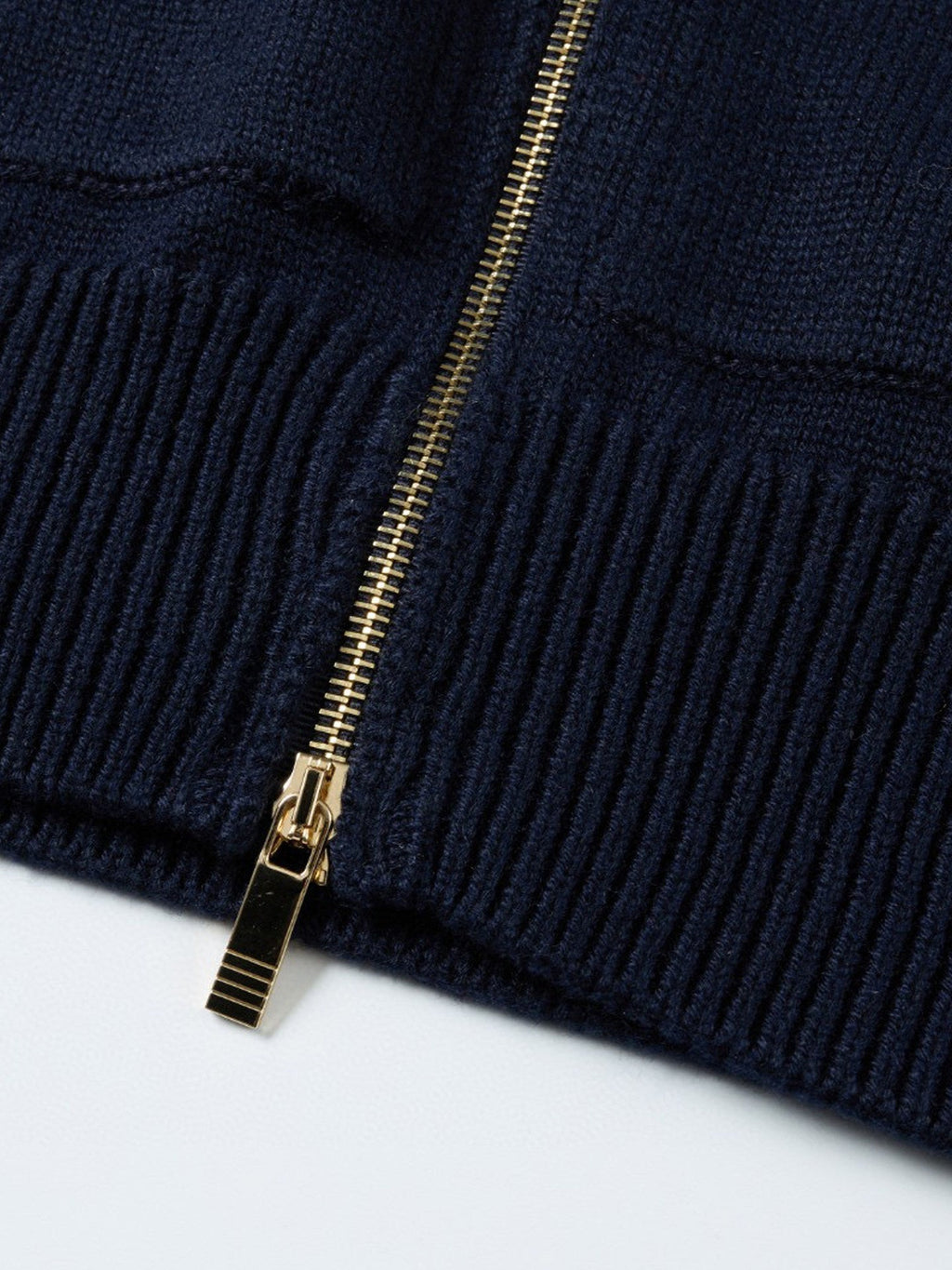 Unisex cardigan by Thom Browne, outerwear detail view