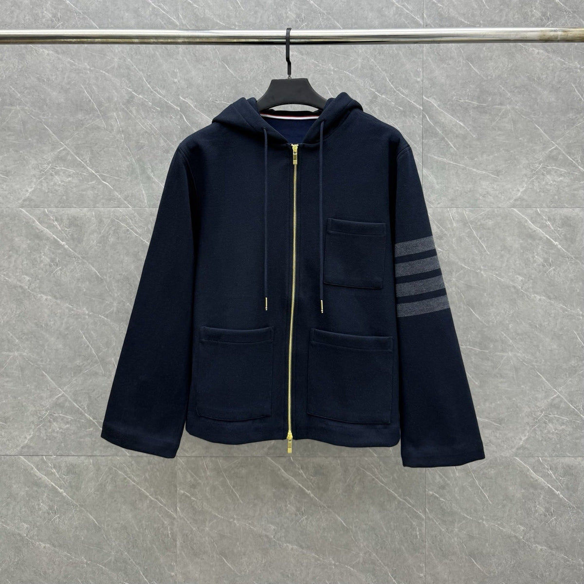 Hooded jacket by Thom Browne, outerwear detail view