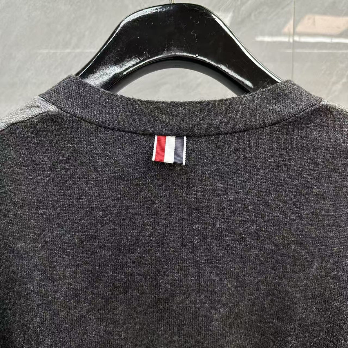 Unisex Two-Tone Cable Knit V-Neck Cardigan - Grey Wool by Thom Browne, outerwear detail view