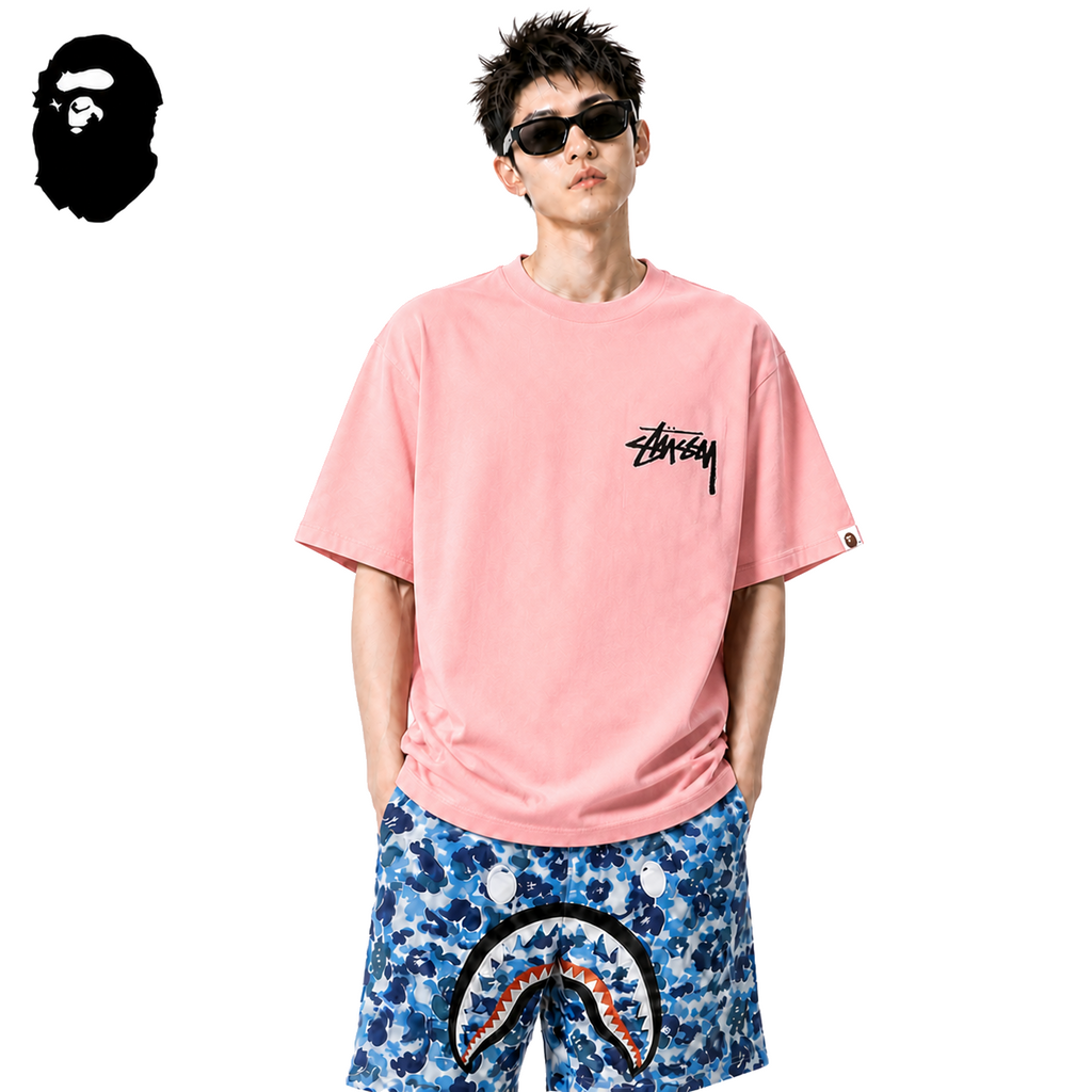BAPE x Stussy Small Logo Men's T-Shirt - Pink - Pink streetwear model on pure white background