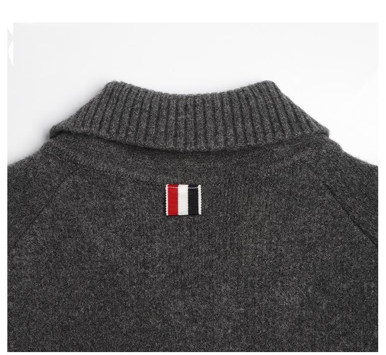 Unisex wool coat with webbing sleeves by Thom Browne, outerwear detail view