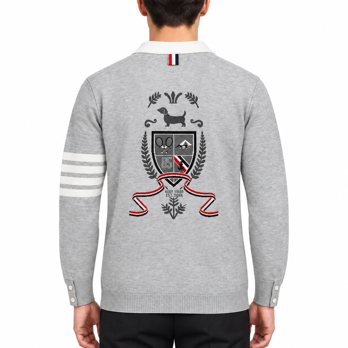 Intarsia Knit Cardigan — Unisex Four-Stripe Badge Sweater by Thom Browne, modeled on a pure white background