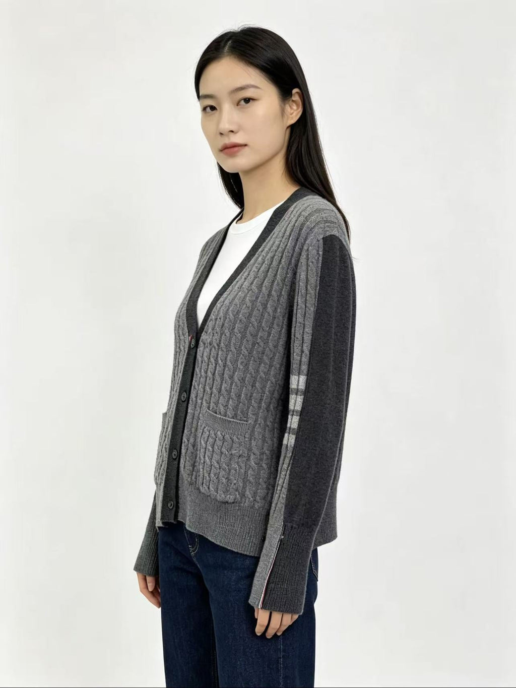 Unisex Two-Tone Cable Knit V-Neck Cardigan - Grey Wool by Thom Browne, outerwear detail view