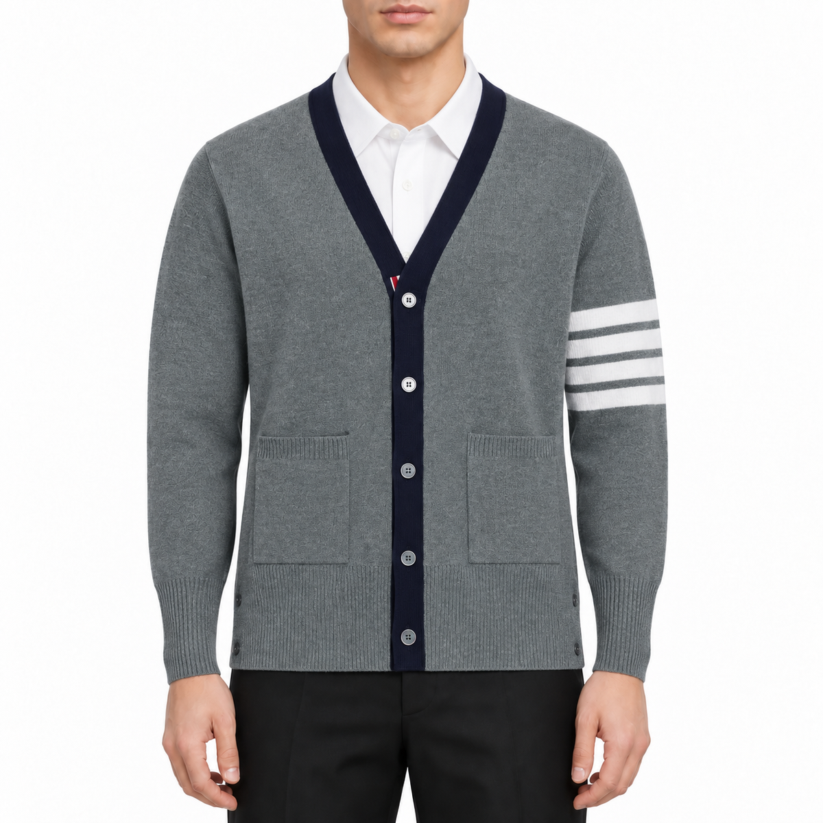 Unisex cardigan by Thom Browne, modeled on a pure white background