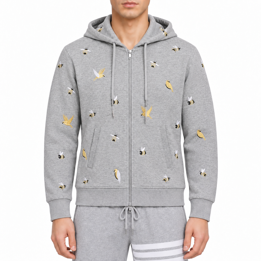 Cardigan by Thom Browne, modeled on a pure white background