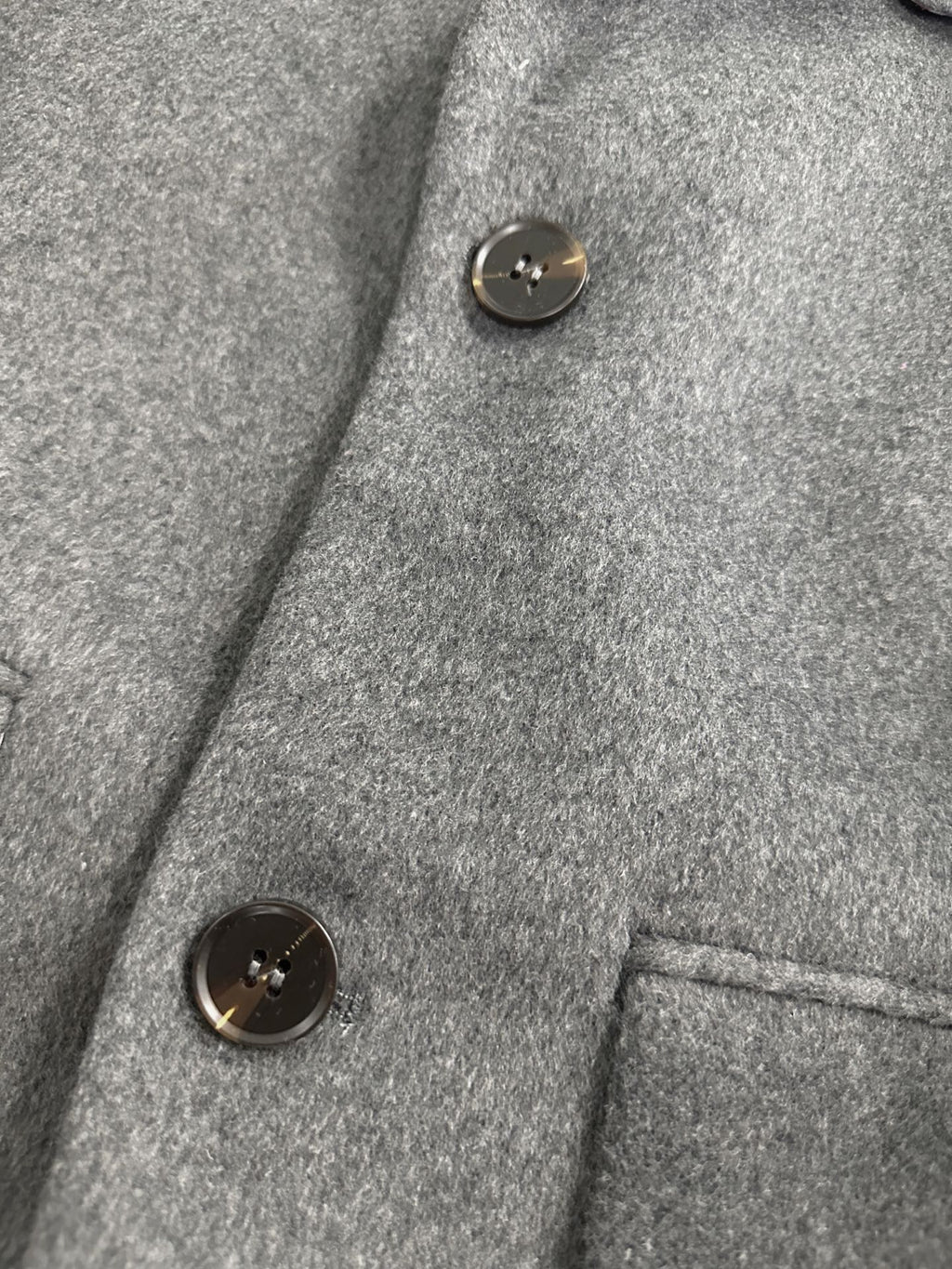 Unisex long wool coat by Thom Browne, outerwear detail view