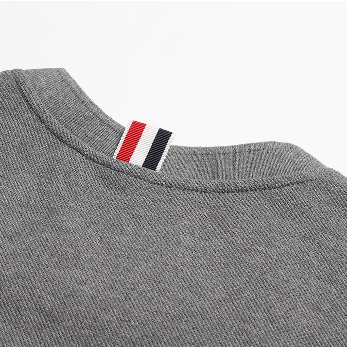 Solid color T-shirt by Thom Browne, product detail view
