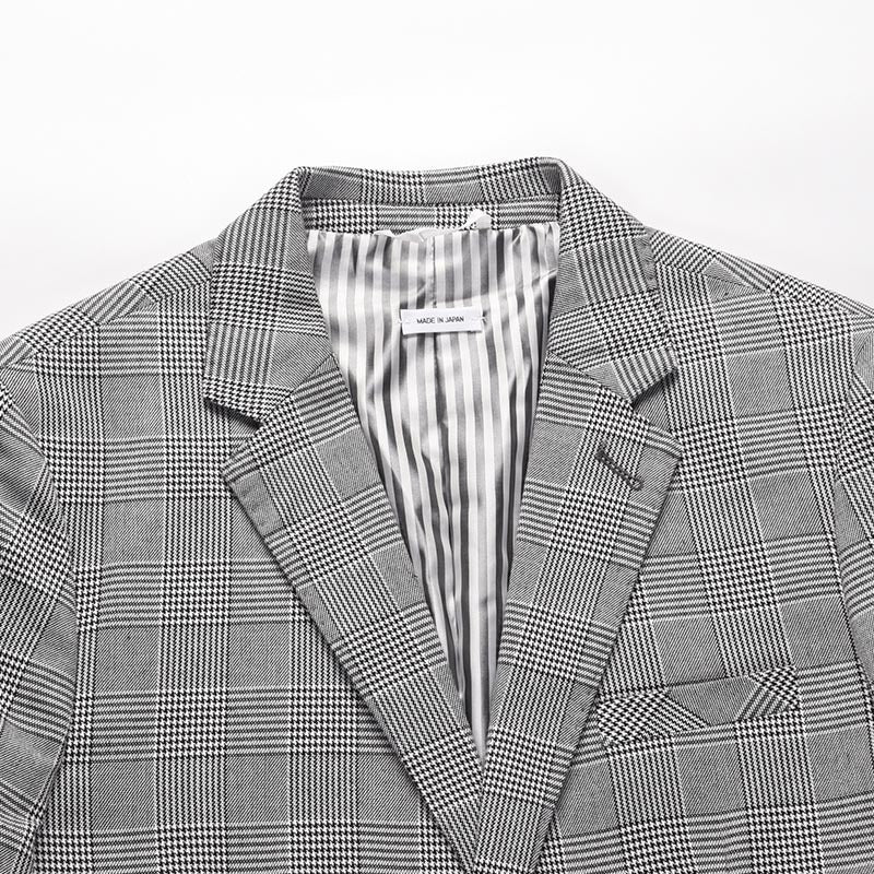 Plaid suit by Thom Browne, outerwear detail view