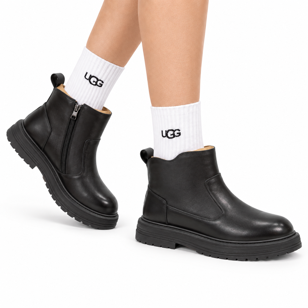 UGG Black Leather Side-Zip Boots - side-angle hero view